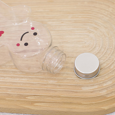 Botellas plásticas del jugo de la Navidad con el casquillo a prueba de fugas, botellas vacías del té de la leche