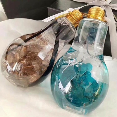 Jarrón de jugo de vidrio de venta caliente con tapa de 100 ml de tamaño pequeño con forma de bombilla de plástico PET