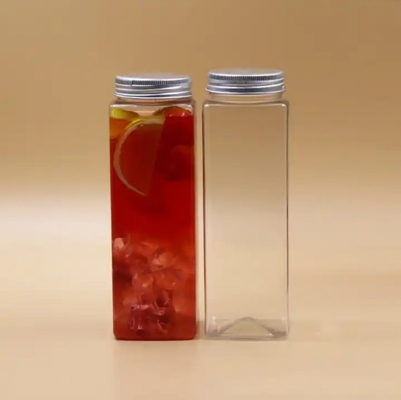 Botellas de té de leche aisladas redondas cuadradas con manija y tornillo de 0,5 kg en la tapa