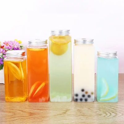 Botellas de té de leche aisladas redondas cuadradas con manija y tornillo de 0,5 kg en la tapa