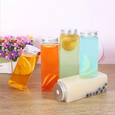 Botellas de té de leche aisladas redondas cuadradas con manija y tornillo de 0,5 kg en la tapa