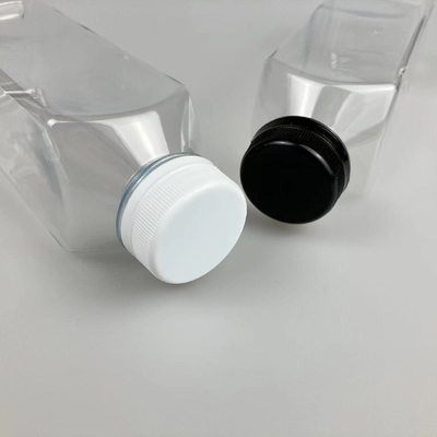 Botellas de té de leche de plástico aisladas con tornillo en la tapa y el mango