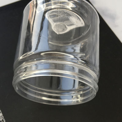 Botella de plástico transparente de venta al por mayor barata botella de plástico transparente con tablillas de tapa botella de plástico en forma de maceta botella de plástico para exfoliante con suministro de fábrica