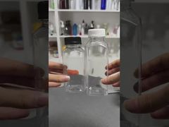 Botellas de jugo de plástico con tapas Contenedores de bebidas claros con tapas para beber